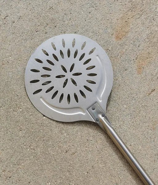 Pala perforada de hornear en acero INOX con mango deslizante